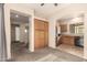 View of the open concept living room connecting to the kitchen and a stairway at 4682 E Redfield Rd, Gilbert, AZ 85234