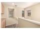 Carpeted staircase landing with multiple windows and natural light at 4682 E Redfield Rd, Gilbert, AZ 85234