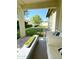 Back patio view showing backyard with manicured trees and plants at 4824 S Brice --, Mesa, AZ 85212