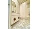 Bathroom featuring white cabinets, floral door pulls, marble floors, and shower at 4824 S Brice --, Mesa, AZ 85212