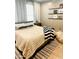 Relaxing bedroom with plush bedding, decorative shelves, and soft lighting, creating a peaceful atmosphere at 4824 S Brice --, Mesa, AZ 85212