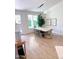 Bright dining room with hardwood floors, modern light fixture, and backyard views at 4824 S Brice --, Mesa, AZ 85212