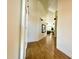 Hallway featuring modern lighting, hardwood floors, and white trim at 4824 S Brice --, Mesa, AZ 85212