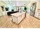 Open-concept kitchen featuring an island, stainless steel appliances and hardwood floors at 4824 S Brice --, Mesa, AZ 85212