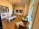 Bright living room boasts a white couch, modern chandelier and elegant artwork at 4824 S Brice --, Mesa, AZ 85212