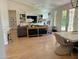 Open-concept living room with fireplace, hardwood floors, neutral decor and access to outdoor space at 4824 S Brice --, Mesa, AZ 85212