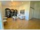 Bright living room features a decorative bookcase, modern chandelier and hardwood floors at 4824 S Brice --, Mesa, AZ 85212