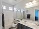 Modern bathroom with double sinks, large mirror, bathtub, and sleek fixtures for comfortable living at 4933 W Melody Ln, Laveen, AZ 85339