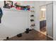 Walk-in closet with custom shelves and storage, adjacent to the bathroom at 4933 W Melody Ln, Laveen, AZ 85339