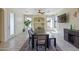 Bright and spacious dining area with a large table, modern decor, and abundant natural light at 4933 W Melody Ln, Laveen, AZ 85339