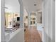 Bright hallway offering seamless transition to the living area, kitchen, and other rooms at 4933 W Melody Ln, Laveen, AZ 85339