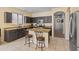 Kitchen featuring granite countertops, stainless steel appliances, and a convenient center island with seating at 4933 W Melody Ln, Laveen, AZ 85339