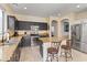 Spacious kitchen boasts stainless steel appliances, granite countertops, a convenient center island, and ample natural light at 4933 W Melody Ln, Laveen, AZ 85339