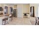 Open-concept kitchen with granite countertops and stainless-steel appliances, featuring a charming desk area and easy access to dining at 4933 W Melody Ln, Laveen, AZ 85339