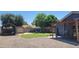 Large backyard featuring a shed, fire pit, and covered patio area at 5539 E Dragoon Ave, Mesa, AZ 85206