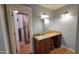 Bright bathroom with granite vanity, tile floors, and shower room with glass door at 5539 E Dragoon Ave, Mesa, AZ 85206