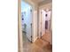 Hallway view into bathroom with tiled walk-in closet and tiled shower with glass door at 5539 E Dragoon Ave, Mesa, AZ 85206
