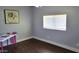 Inviting bedroom with natural light streaming through the window. Artwork adorns the walls at 5539 E Dragoon Ave, Mesa, AZ 85206