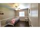 Cozy bedroom features a ceiling fan, natural light, and neutral color palette, creating a relaxing atmosphere at 5539 E Dragoon Ave, Mesa, AZ 85206