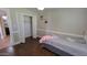 Bright bedroom with closet, ceiling fan and wood floors; a comfortable retreat for rest and relaxation at 5539 E Dragoon Ave, Mesa, AZ 85206