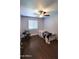 Comfortable bedroom with a ceiling fan and natural light is perfect for relaxation and rest at 5539 E Dragoon Ave, Mesa, AZ 85206