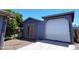 Detached garage with double doors, offering ample parking and storage space at 5539 E Dragoon Ave, Mesa, AZ 85206