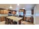 Spacious kitchen featuring granite countertops, stainless steel appliances, and custom wood cabinetry at 5539 E Dragoon Ave, Mesa, AZ 85206