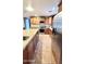 Well-lit kitchen boasts stainless steel appliances, a granite island, and plenty of cabinet space at 5539 E Dragoon Ave, Mesa, AZ 85206