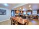Open concept kitchen features stainless steel appliances and granite countertops, adjacent to dining area at 5539 E Dragoon Ave, Mesa, AZ 85206
