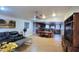 Spacious living room with tile floors and plenty of natural light adjacent to the kitchen and dining area at 5539 E Dragoon Ave, Mesa, AZ 85206