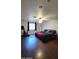Large main bedroom with a ceiling fan, dark wood floors, and a bright window at 5539 E Dragoon Ave, Mesa, AZ 85206
