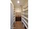 Walk-in pantry with custom shelving and counter space provides ample storage at 5539 E Dragoon Ave, Mesa, AZ 85206