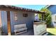 Outdoor patio bar area with a wooden bench and a custom bar setup at 5539 E Dragoon Ave, Mesa, AZ 85206