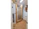 Stylish bathroom featuring a tiled shower stall with a glass door and convenient shelving at 5539 E Dragoon Ave, Mesa, AZ 85206