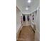 Spacious walk-in closet with custom shelving, hanging racks, and tile flooring offers organized storage at 5539 E Dragoon Ave, Mesa, AZ 85206