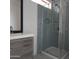 Stylish bathroom featuring modern vanity, framed mirror, and tiled shower at 5916 W Pierce St, Phoenix, AZ 85043