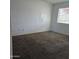 Cozy bedroom with plush carpet and natural light at 5916 W Pierce St, Phoenix, AZ 85043