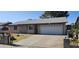 Charming single-story home features a two-car garage and a well-maintained front yard and driveway at 5916 W Pierce St, Phoenix, AZ 85043
