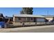 Charming single-story home features a two-car garage and a well-maintained front yard and driveway at 5916 W Pierce St, Phoenix, AZ 85043