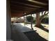 Spacious covered patio overlooking a large tree at 5916 W Pierce St, Phoenix, AZ 85043