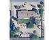 An aerial view of the home showcasing a backyard with a small lawn, desert landscaping, and perimeter trees at 6249 E Larkspur Dr, Scottsdale, AZ 85254