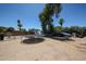 Oversized backyard with mature trees, a trampoline, and additional storage space at 6249 E Larkspur Dr, Scottsdale, AZ 85254