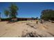 View of the backyard showcasing rock features, brick trimmed border, and sparse landscaping at 6249 E Larkspur Dr, Scottsdale, AZ 85254
