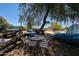 Large backyard with trees, furniture, car and trailer at 6249 E Larkspur Dr, Scottsdale, AZ 85254