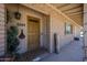 Inviting front porch featuring a welcome sign, plants, and brick accents at 6249 E Larkspur Dr, Scottsdale, AZ 85254