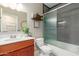 Updated bathroom featuring tiled shower and vanity at 6319 W Mercer Ln, Glendale, AZ 85304