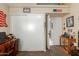 Bedroom features sliding door closet and adjacent doorway with decor at 6319 W Mercer Ln, Glendale, AZ 85304