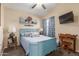 Charming bedroom with a ceiling fan and natural light at 6319 W Mercer Ln, Glendale, AZ 85304