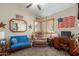 Cozy bedroom featuring a recliner, and desk with patriotic decor at 6319 W Mercer Ln, Glendale, AZ 85304