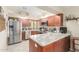Spacious kitchen with stainless steel appliances and granite countertops at 6319 W Mercer Ln, Glendale, AZ 85304